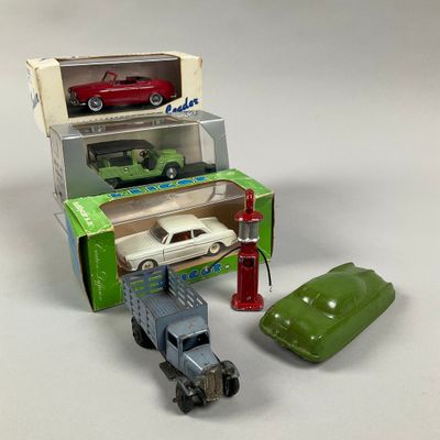 two toy cars and a toy car in a box