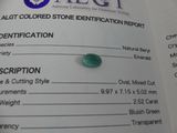a close up of a piece of emerald on a table