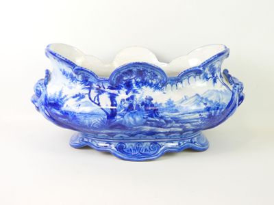 a blue and white bowl with a design on it