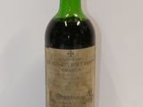 a bottle of wine that is sitting on a table