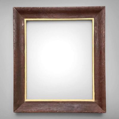 a wooden frame with a white background on a gray wall
