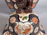 a decorative vase with a lion on top of it