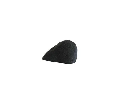a black rock sitting on top of a white surface