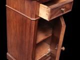 an image of a small wooden cabinet with a drawer