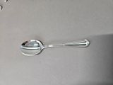 a spoon and a spoon rest on a table