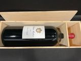 a bottle of wine in a wooden box on a table