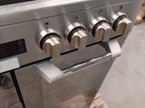 four burners on the stove in this kitchen