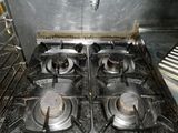 two burners on the stove in the kitchen