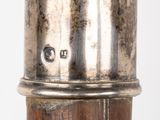 an image of a close up of a metal object on a wooden pole