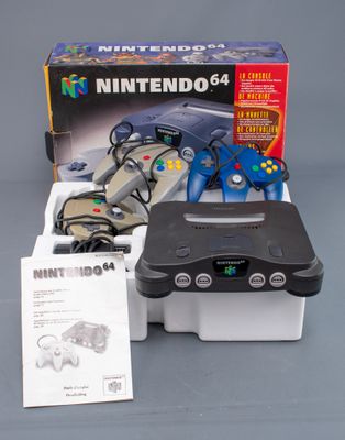 an image of a nintendo 64 game system with controllers and accessories
