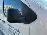 a white van parked on the side of the road