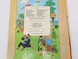 an old children ' s book with a picture of a man and a woman sitting on a bench
