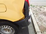 a yellow van parked on the side of the road