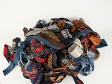 a pile of ties on a white surface