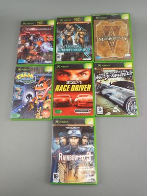 a bunch of video games sitting on top of a table