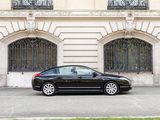 a black car that is parked in front of a building
