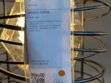 a picture of a metal cage with a tag on it