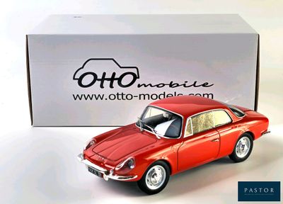 a toy car that is sitting in front of a box