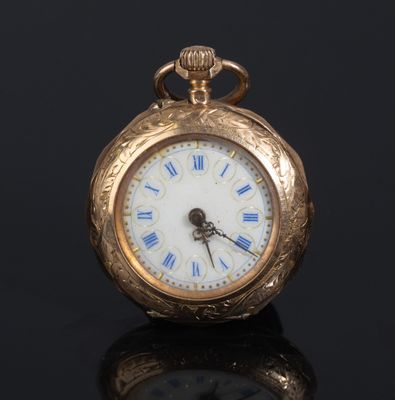 an antique gold pocket watch with roman numerals and roman numerals on the face