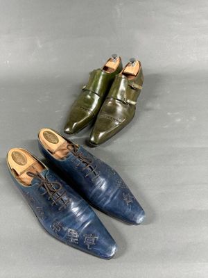three pairs of blue and green shoes sitting on a gray surface