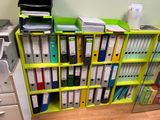 many files on the shelves in this office