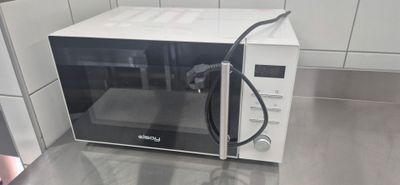 a microwave that is sitting on a counter in a kitchen