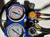 a close up of a couple of gauges on a table