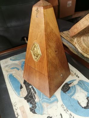 a wooden pyramid shaped object on a table