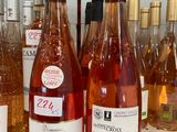 several bottles of wine are lined up on a table