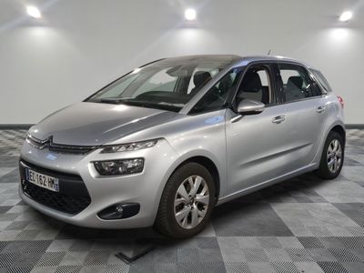 the silver citrole is parked on a checkered floor