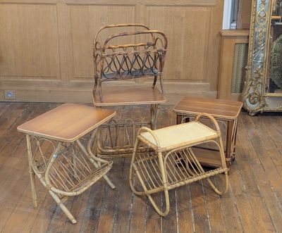 three chairs and a table in a room with a mirror