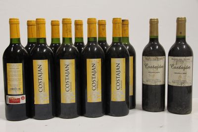six bottles of red wine are lined up in a row