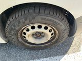 a close up of a tire on the side of a car