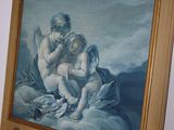 a picture of a painting hanging on a wall next to a mirror