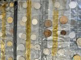 a lot of coins that are in a plastic bag