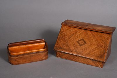 a small wooden box and a small wooden box on a gray surface