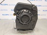 a picture of a blower motor on a table in front of a wall