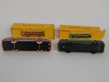 two toy trains are sitting next to each other on a white surface