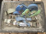 a box full of different types of belts and buckles