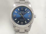 rolex oyster blue dial watch on a stainless steel bracelet