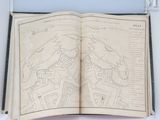 an open book with a map of a city on it