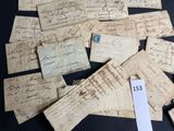 several pieces of old paper with writing on them sitting on a table