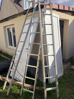 a ladder that is leaning against the wall of a house