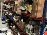 many boxes and cans of paint on the shelves in the warehouse