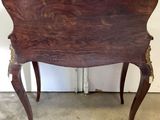 a wooden table with a wooden top and legs