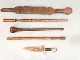 four different types of wooden tools on a white surface