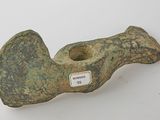 an old pipe that is sitting on a table