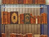 many books on display in a glass case