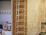 a ladder that is leaning against a wall in a room