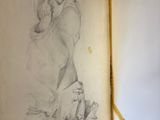 an old book with a drawing of a woman on it